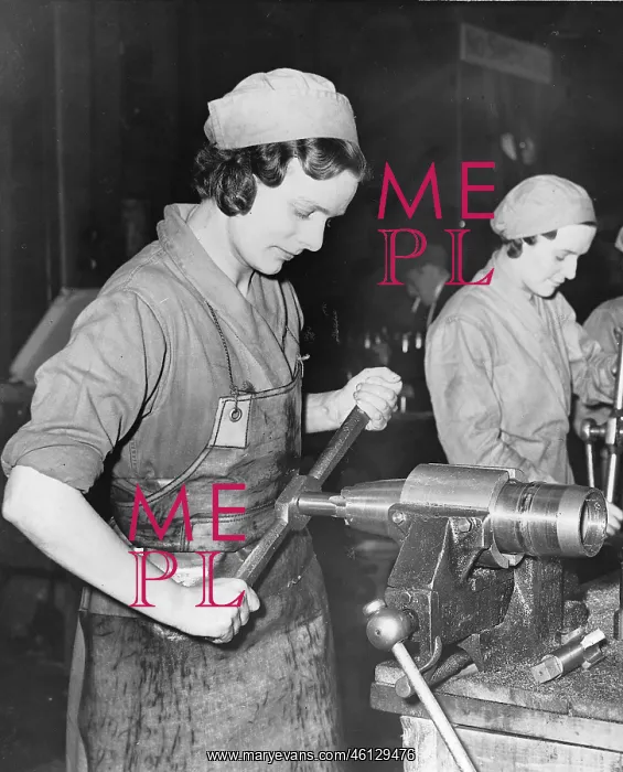 : Woman constructing a shell casing in Factory : Woman constructing a shell casing in Factory