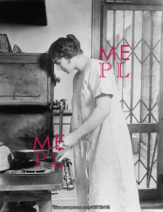 : Woman cooking on stove