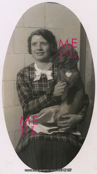  : Woman with a dachshund on her lap