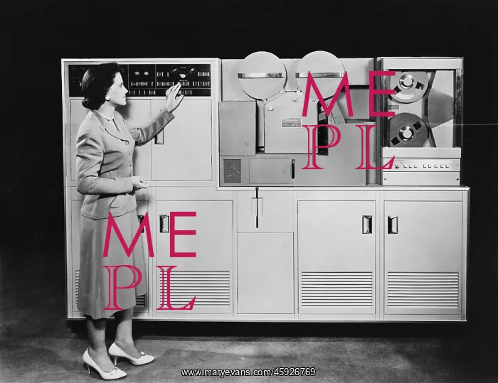 : Woman demonstrating 1950s computer : Woman demonstrating 1950s computer