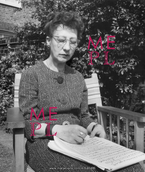 : Woman doing automatic writing in a garden : Woman doing automatic writing in a garden