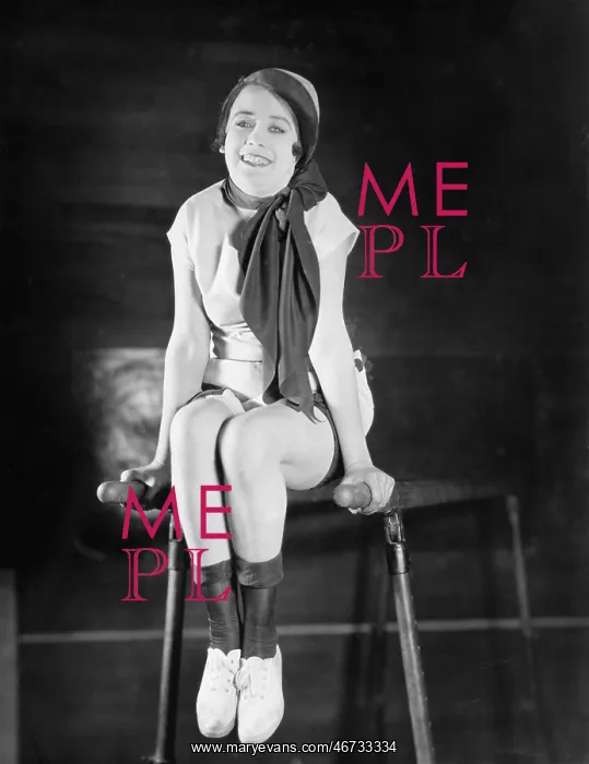 : Woman doing gymnastics on parallel bars : Woman doing gymnastics on parallel bars