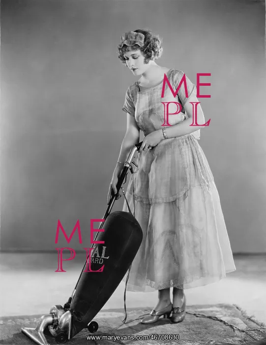 : Woman doing housework with a vacuum cleaner : Woman doing housework with a vacuum cleaner