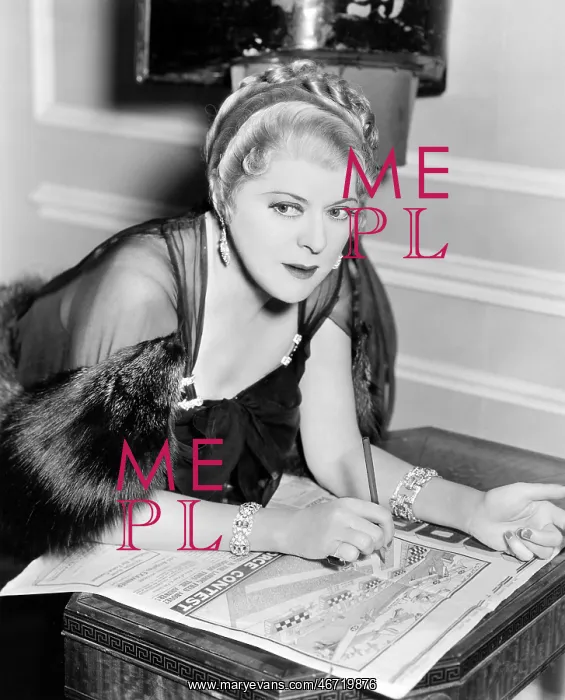 : Woman doing puzzle in newspaper : Woman doing puzzle in newspaper