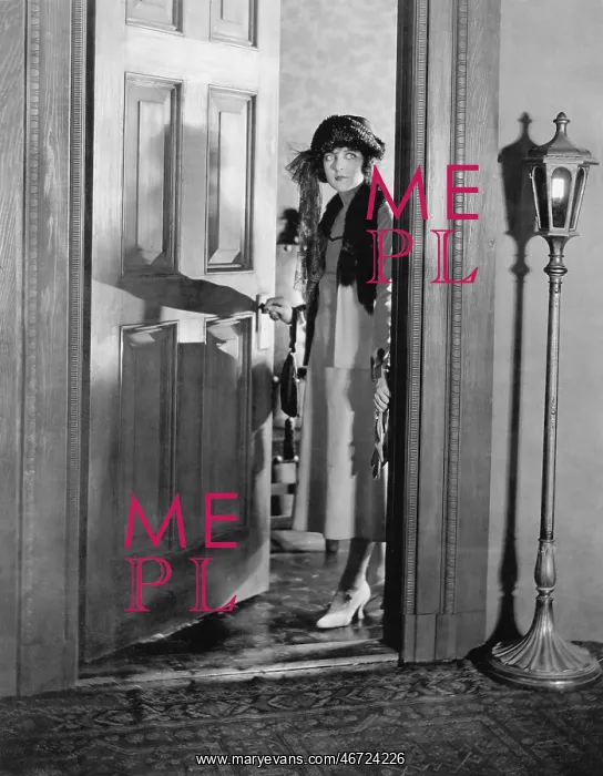 : Woman dressed up standing in the doorway : Woman dressed up standing in the doorway
