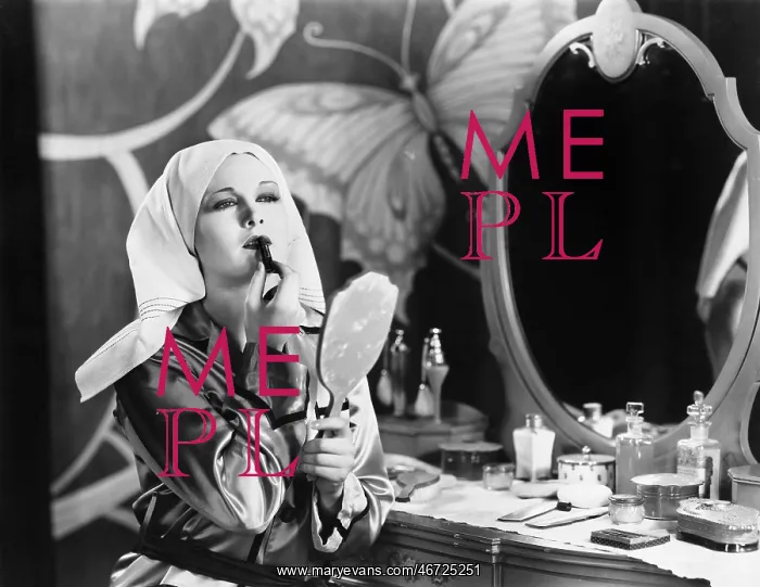  : Woman at dressing table applying cosmetics