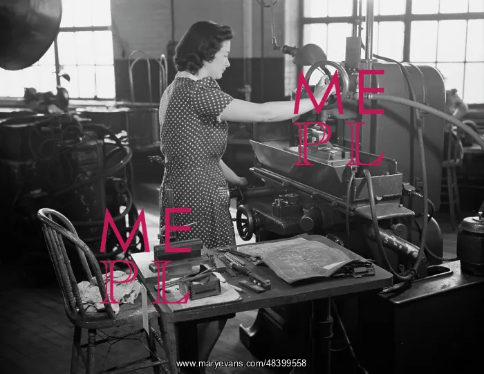 : Woman factory worker operating machine, 1942 : Woman factory worker operating machine, 1942