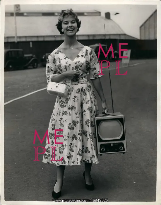 : Woman with first portable TV set : Woman with first portable TV set
