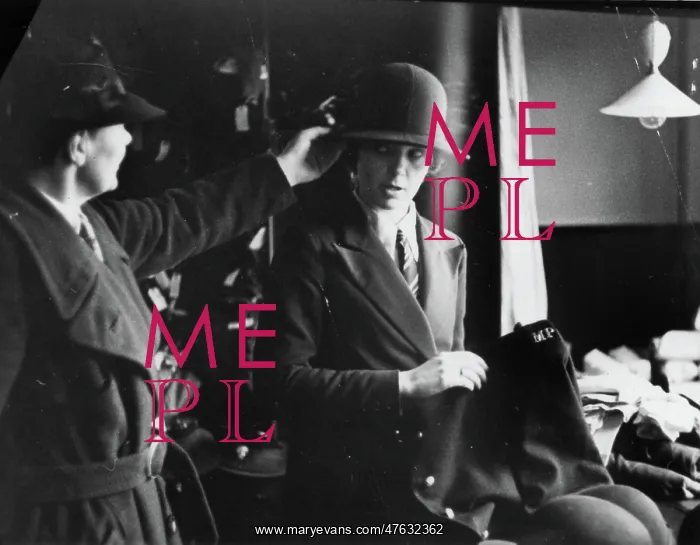 : Woman being fitted with policewoman's uniform : Woman being fitted with policewoman's uniform
