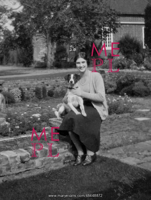  : Woman in garden with her dog