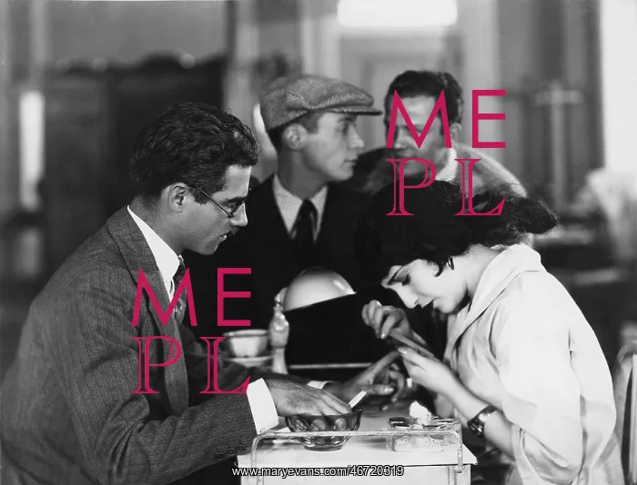: Woman giving man a manicure : Woman giving man a manicure