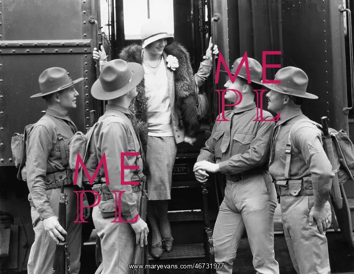 : Woman being greeted by four soldiers : Woman being greeted by four soldiers