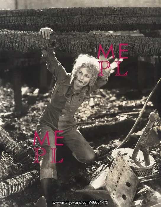: Woman hanging on to fallen logs : Woman hanging on to fallen logs