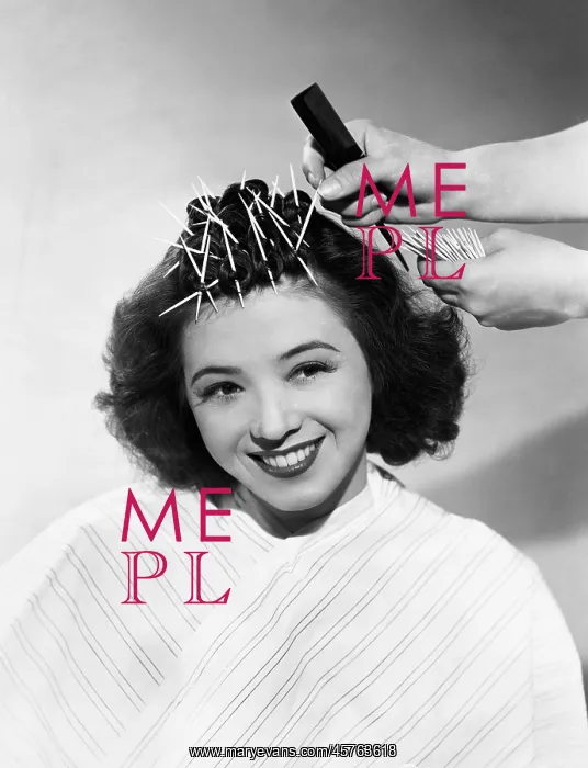  : Woman having her hair styled