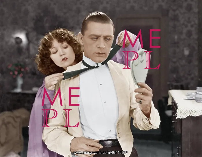 : Woman helping man tie bow tie : Woman helping man tie bow tie