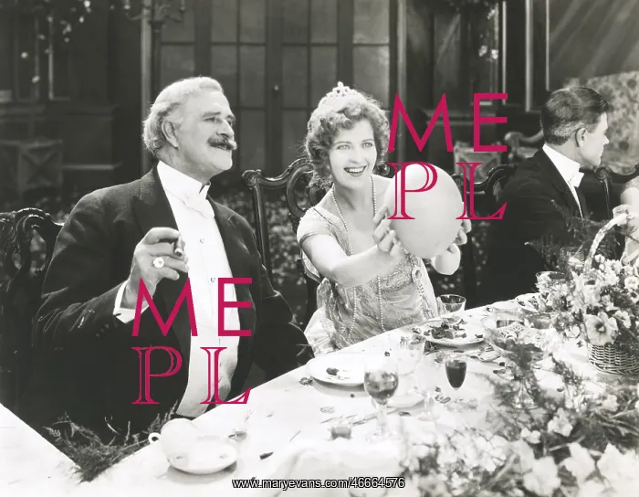 : Woman holding balloon at dinner party : Woman holding balloon at dinner party