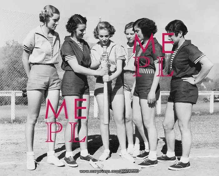 : Woman holding a baseball bat and giving training : Woman holding a baseball bat and giving training