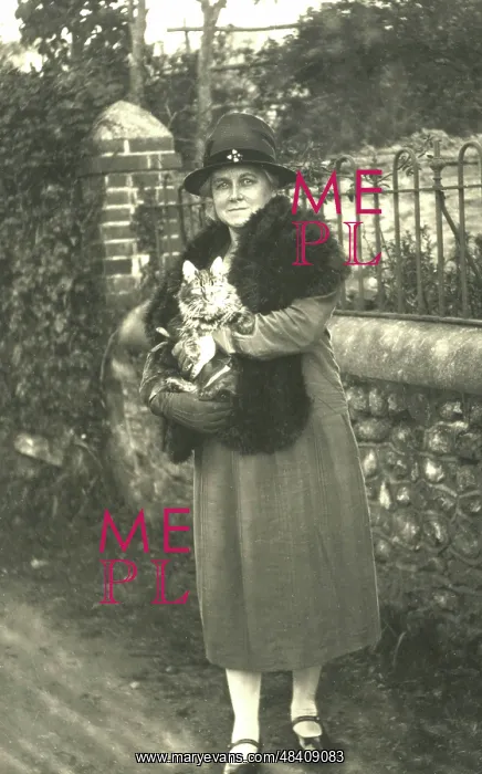  : Woman holding a cat