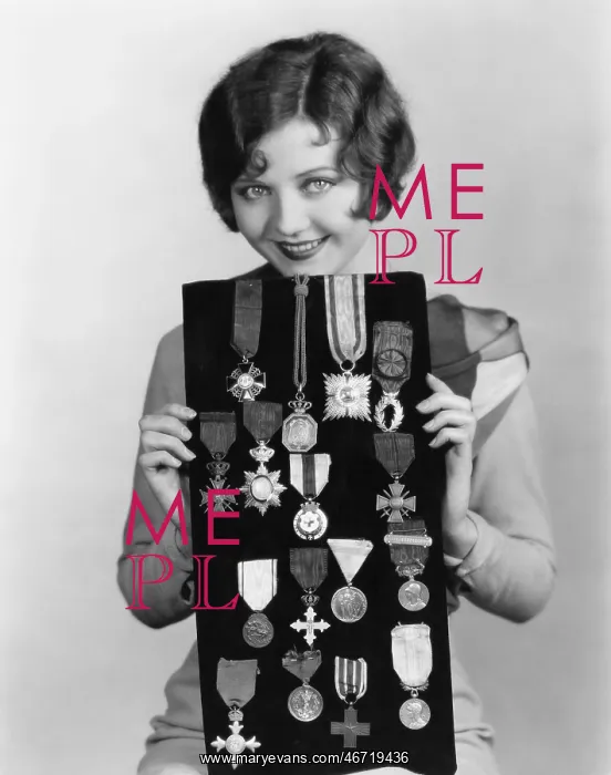 : Woman holding display of medals : Woman holding display of medals