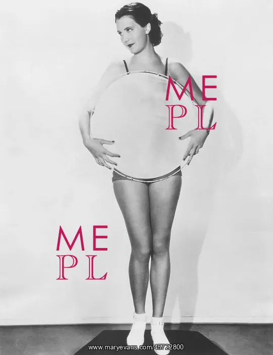  : Woman holding a large circle in front of her torso