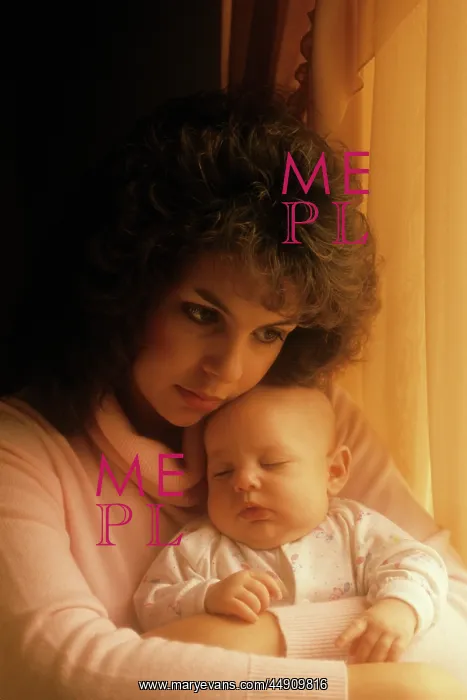 : Woman holding sleeping baby : Woman holding sleeping baby