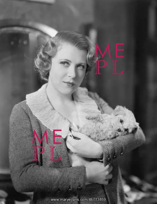 : Woman holding tiny puppy : Woman holding tiny puppy