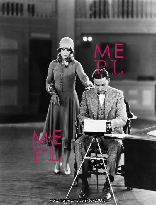 : Woman interrupting man at typewriter : Woman interrupting man at typewriter