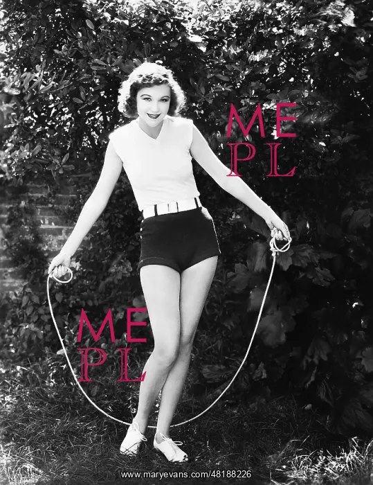 : A woman jumping over a skipping rope : A woman jumping over a skipping rope