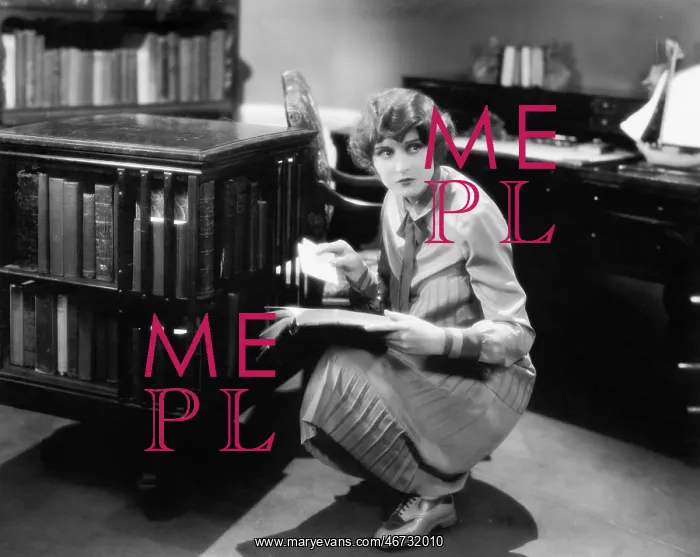 : Woman kneeling with a book in her library finding a letter : Woman kneeling with a book in her library finding a letter