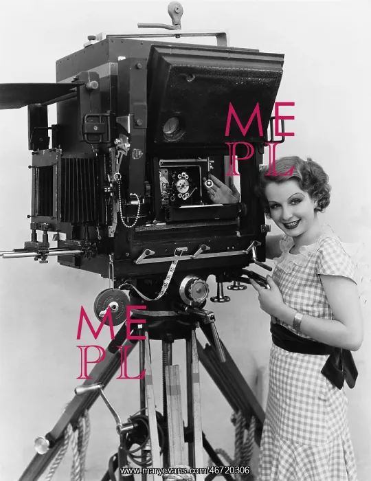 : Woman with large camera : Woman with large camera