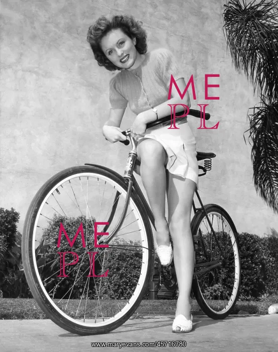  : Woman leaning on her bicycle