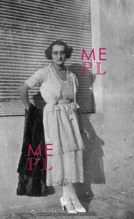  : Woman leans against a wall