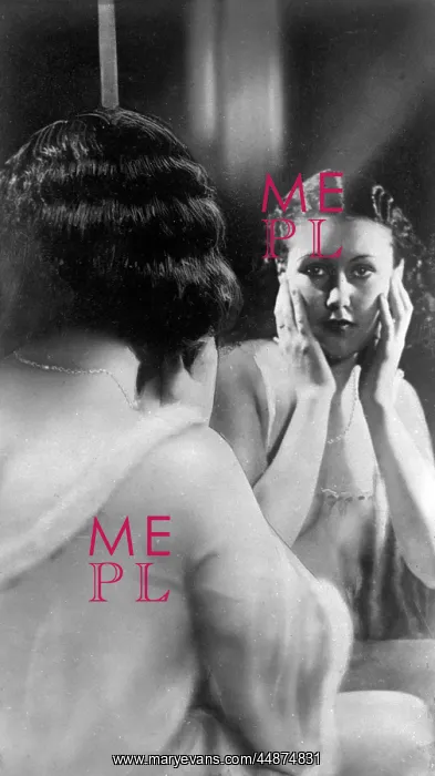 : Woman looking in a dressing table mirror : Woman looking in a dressing table mirror