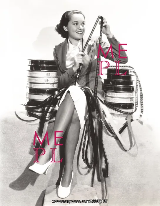 : Woman looking at filmstrips : Woman looking at filmstrips