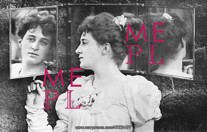 : Woman looking through mirror at her reflection : Woman looking through mirror at her reflection