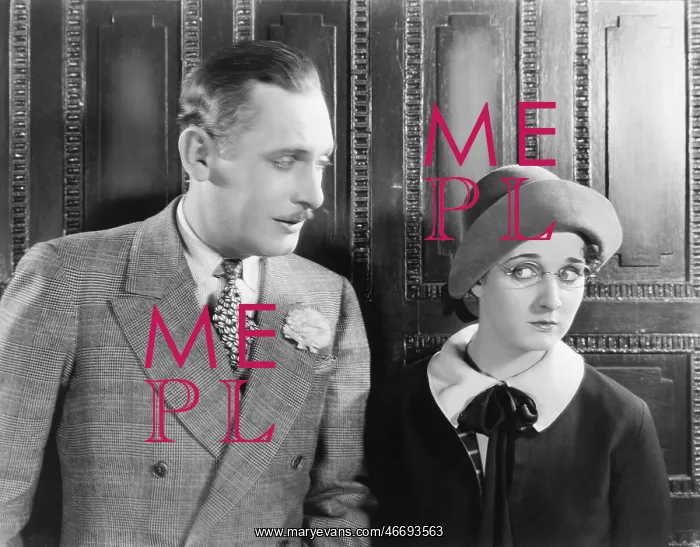 : Woman looking shyly at a man next to her : Woman looking shyly at a man next to her