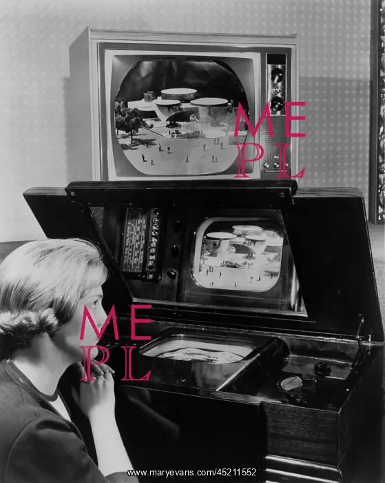 : Woman looking at two television sets. One, ? : Woman looking at two television sets. One, ?