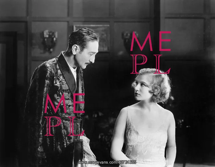 : Woman looking unhappy at a man in a robe : Woman looking unhappy at a man in a robe