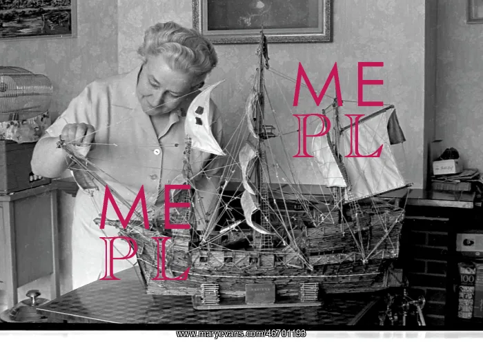 : Woman with model ship made of matchsticks : Woman with model ship made of matchsticks