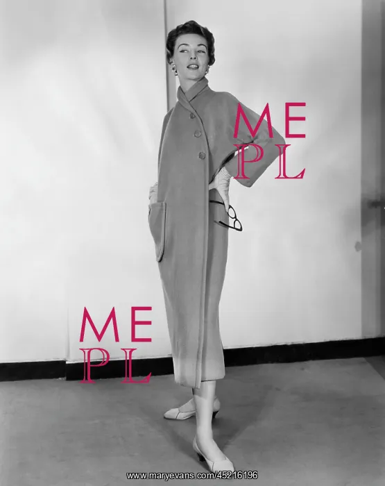: A woman models a camel fleece coat designed ? : A woman models a camel fleece coat designed ?