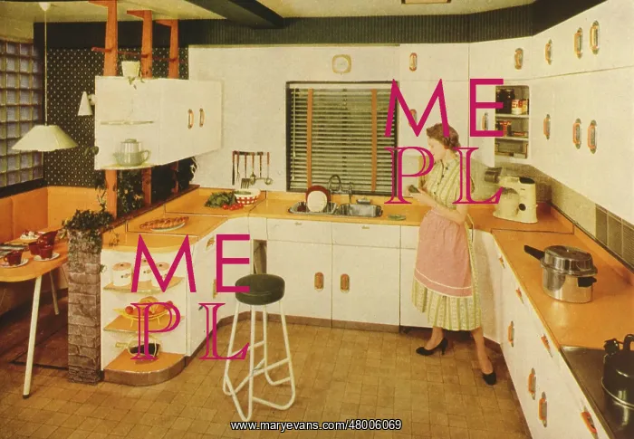 : Woman in a modern fitted kitchen