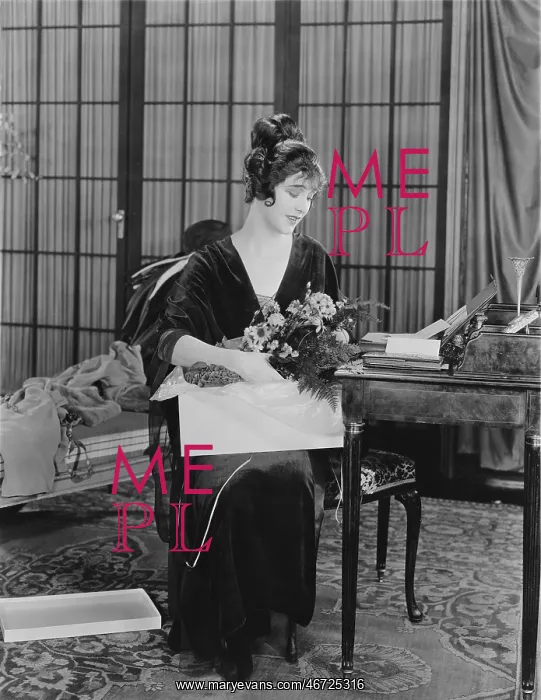 : Woman opening box of flowers : Woman opening box of flowers
