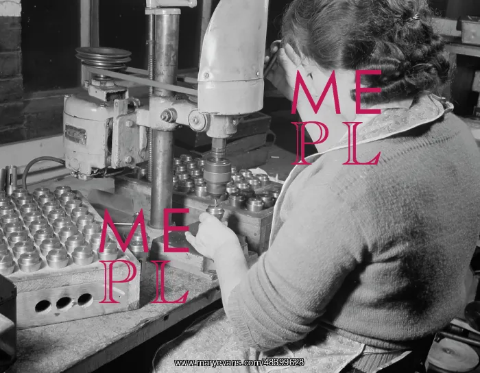 : Woman operating a drill press, 1942 : Woman operating a drill press, 1942