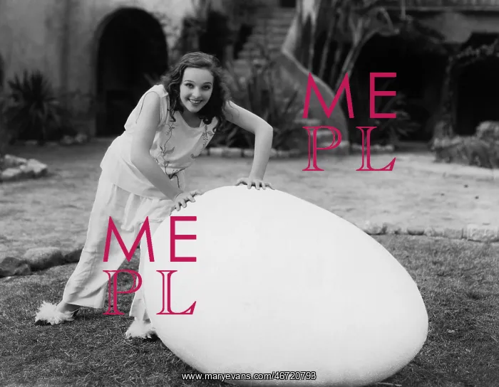 : Woman outside with giant egg : Woman outside with giant egg