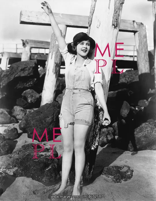  : Woman with pilings at beach