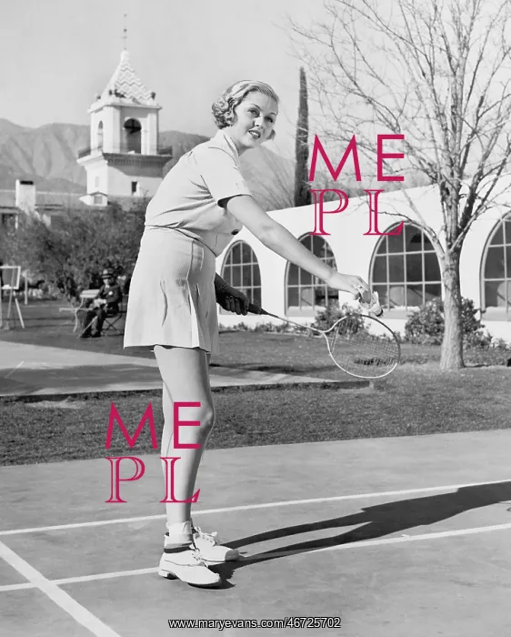 : Woman playing badminton : Woman playing badminton