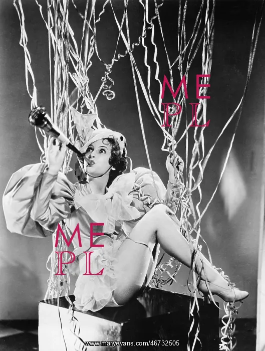  : Woman playing a horn with streamers around her
