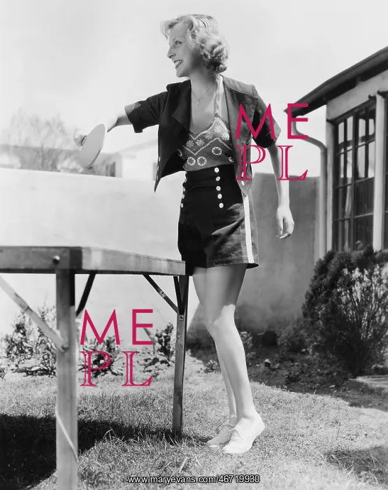  : Woman playing ping pong outside