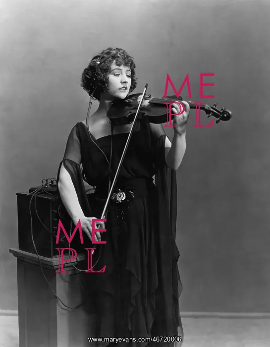 : Woman playing violin with headphones : Woman playing violin with headphones