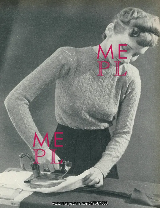  : Woman pressing a seam under a damp cloth